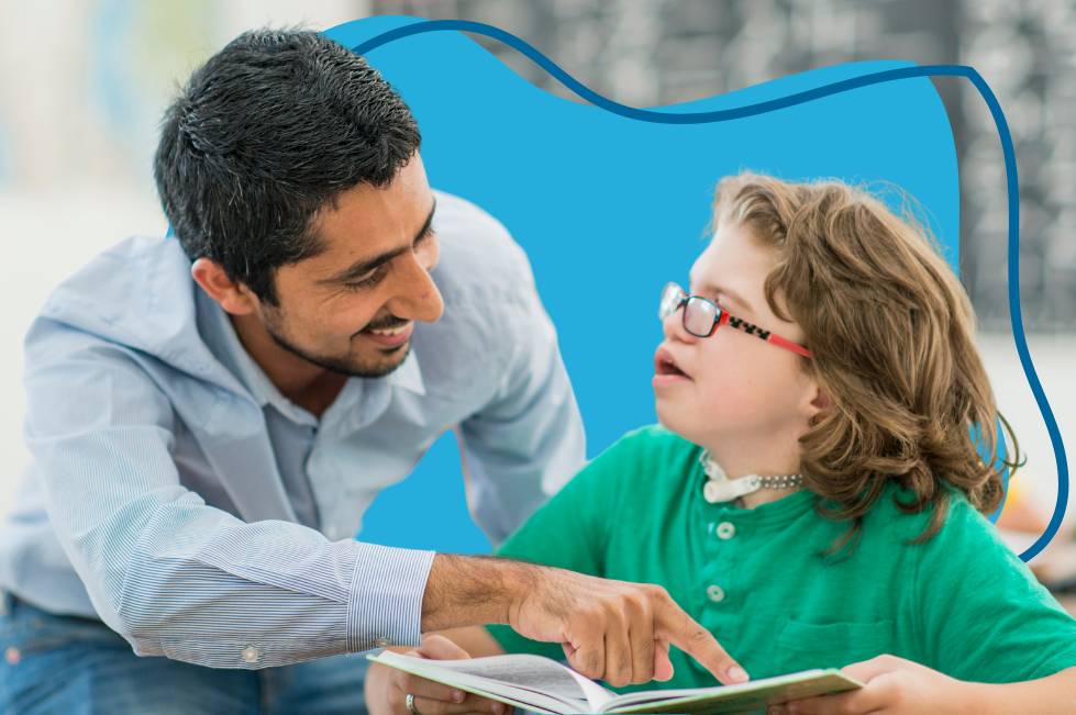 A teacher and student working on school work together